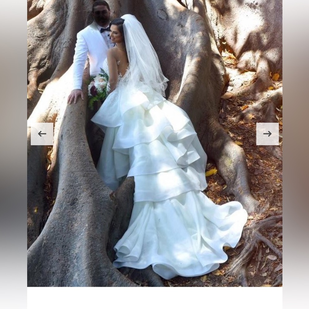 Custom design one of kind Bride dress by Karoza!!! Will fit about a size 4.